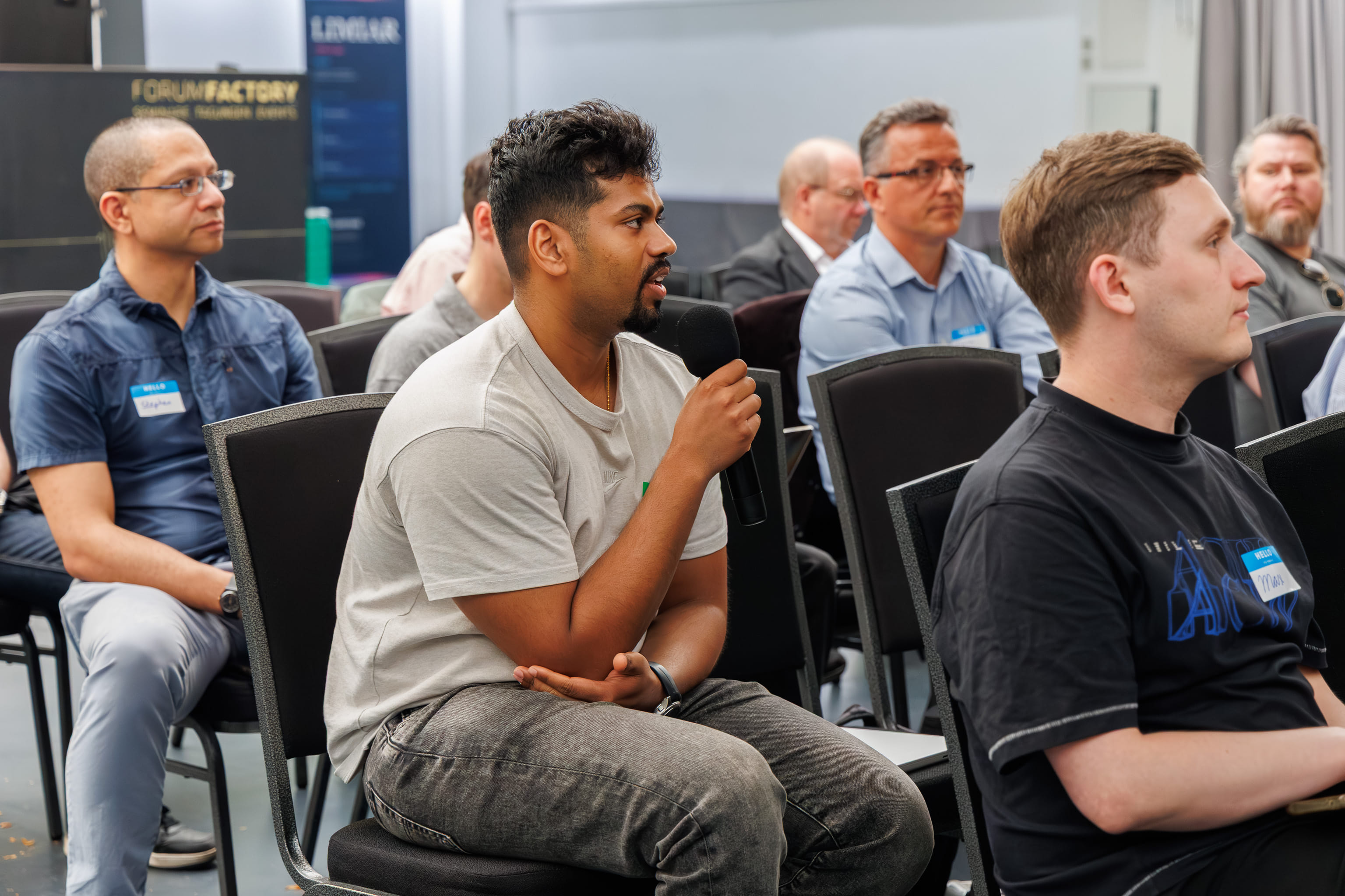 An attendee asking a question during a panel discussion at XR Futures Conference 2026